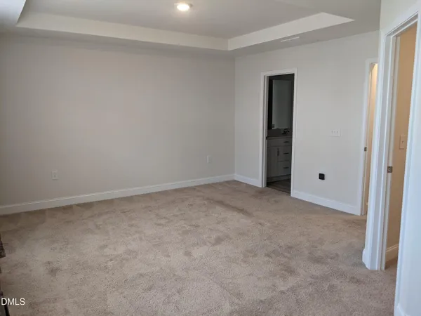 a view of an empty room and entryway