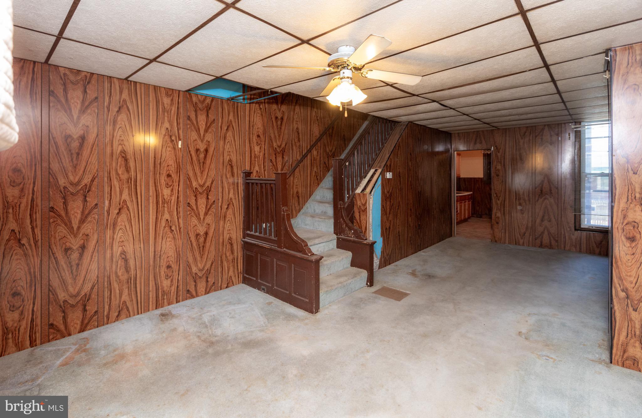 6519 Marsden Street Philadelphia, PA 19135 - Photo 2 of 24 a view of an empty room with wooden walls