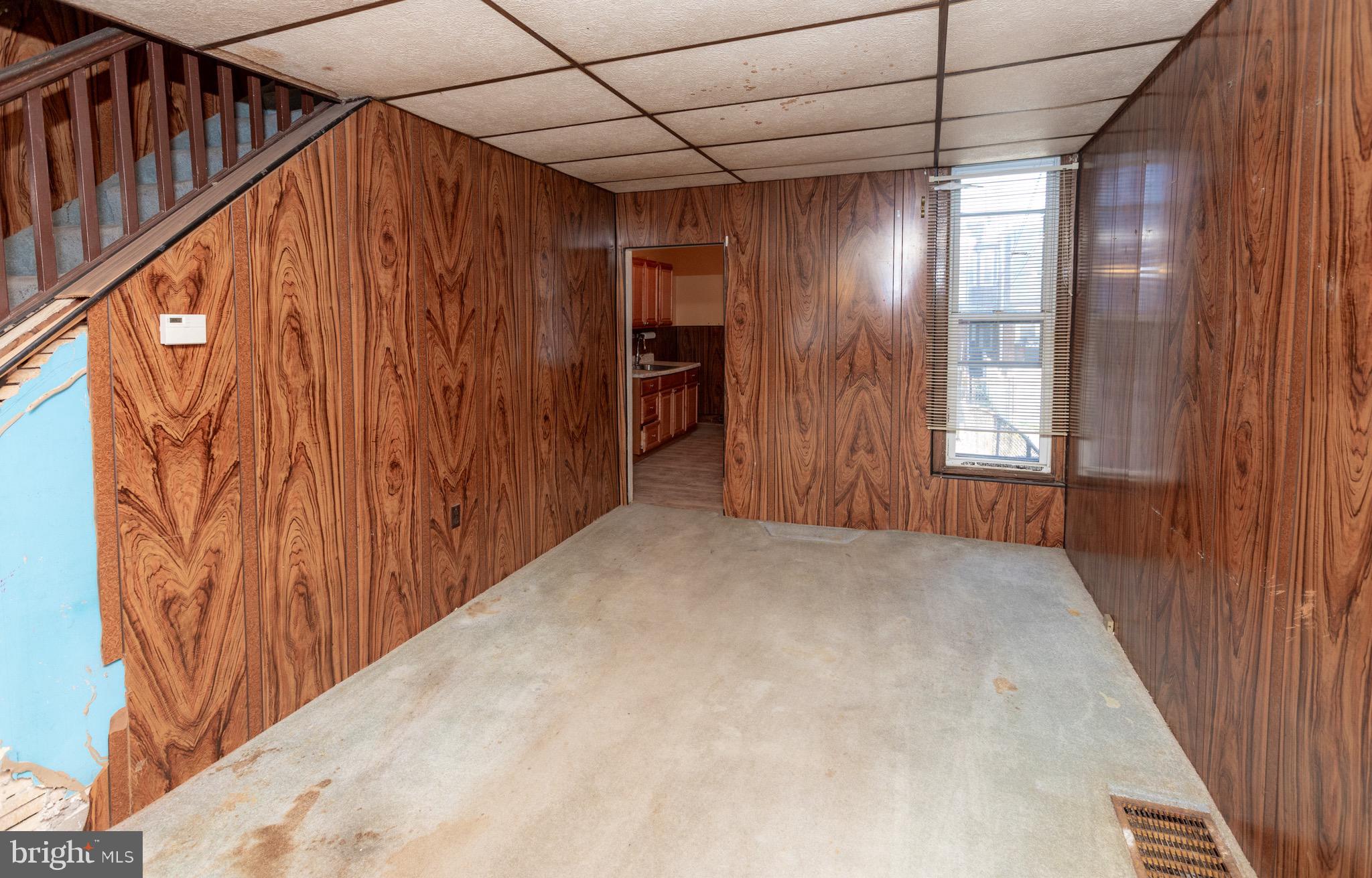 6519 Marsden Street Philadelphia, PA 19135 - Photo 5 of 24 a view of an empty room with a window