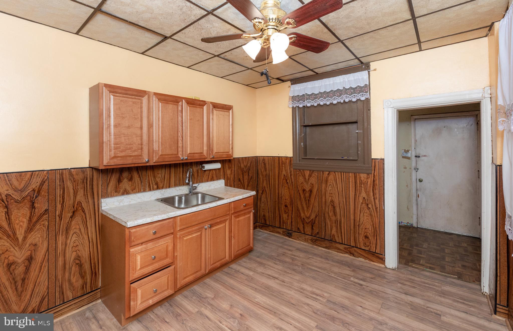 6519 Marsden Street Philadelphia, PA 19135 - Photo 7 of 24 a bathroom with a sink and a mirror