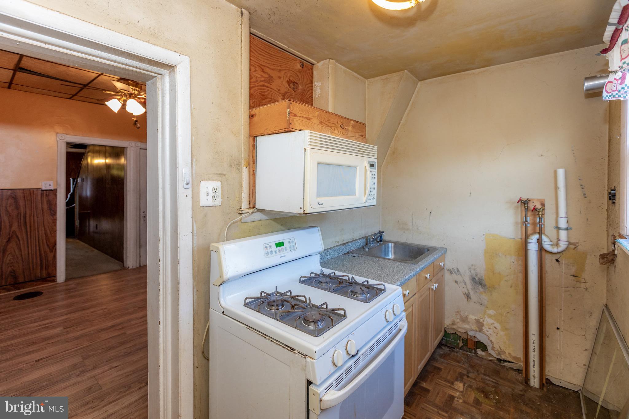 6519 Marsden Street Philadelphia, PA 19135 - Photo 9 of 24 a bathroom with a sink toilet and shower