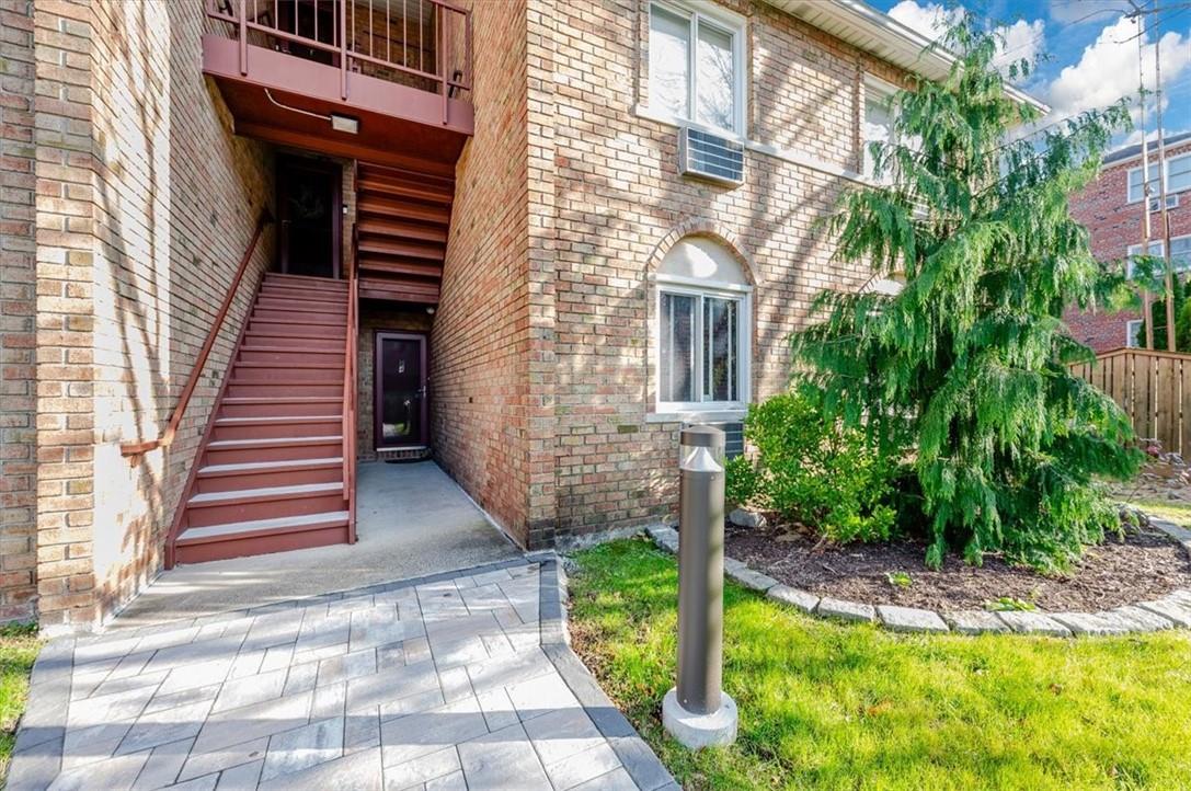 1530 Bayview Avenue, Unit 9 Bronx, NY 10465 - Photo 1 of 1 a view of a backyard with plants and large trees