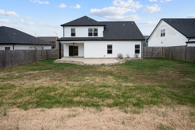 a view of a back yard of the house