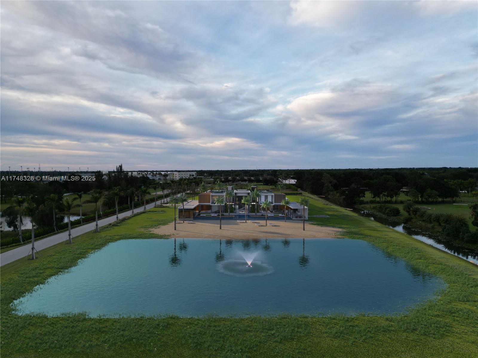 4730 Akai Drive Southwest Ranches, FL 33332 - Photo 13 of 14 a view of a swimming pool with a garden
