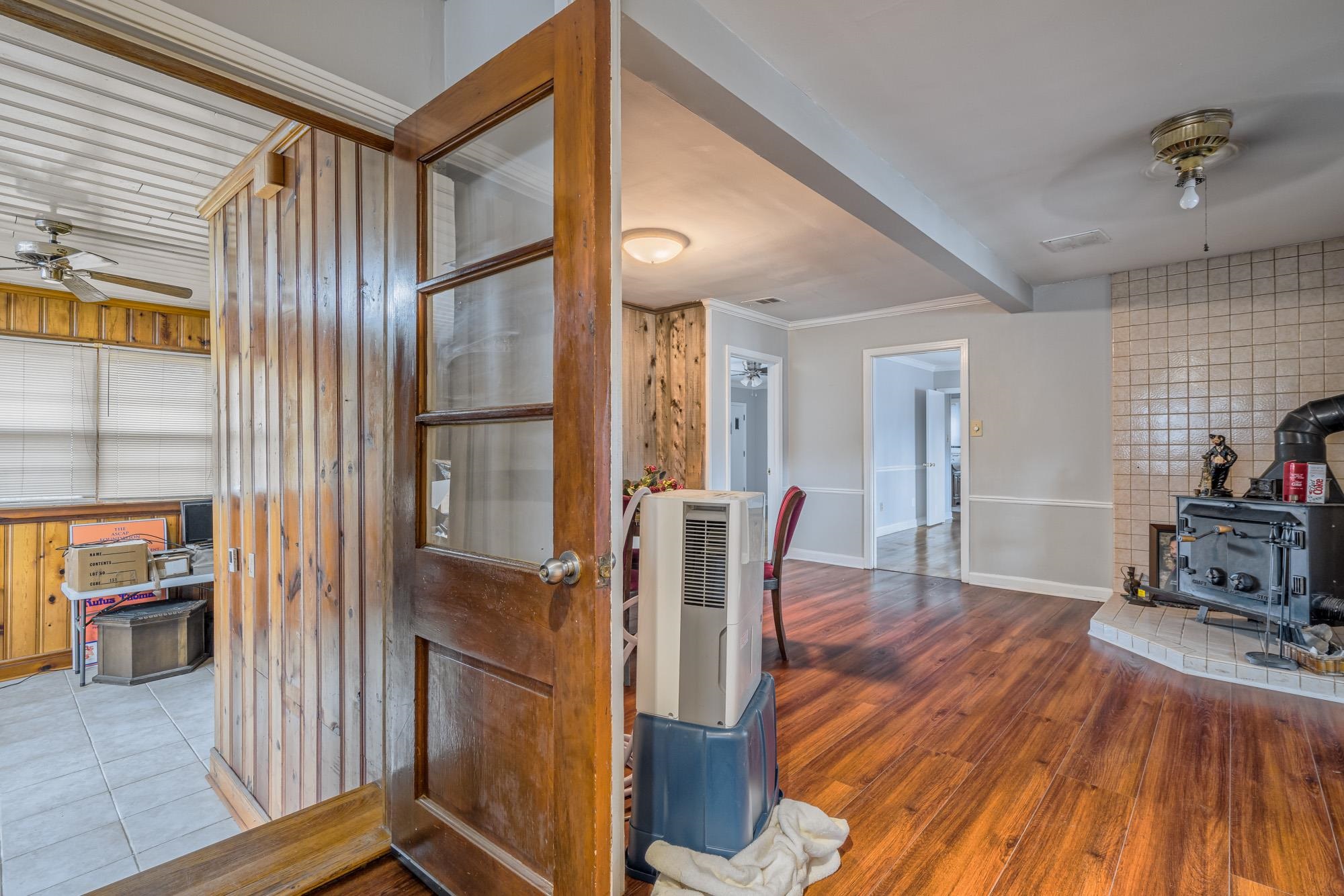 3087 James Road Memphis, TN 38128 - Photo 19 of 25 a view of a hallway with wooden floor and dining room