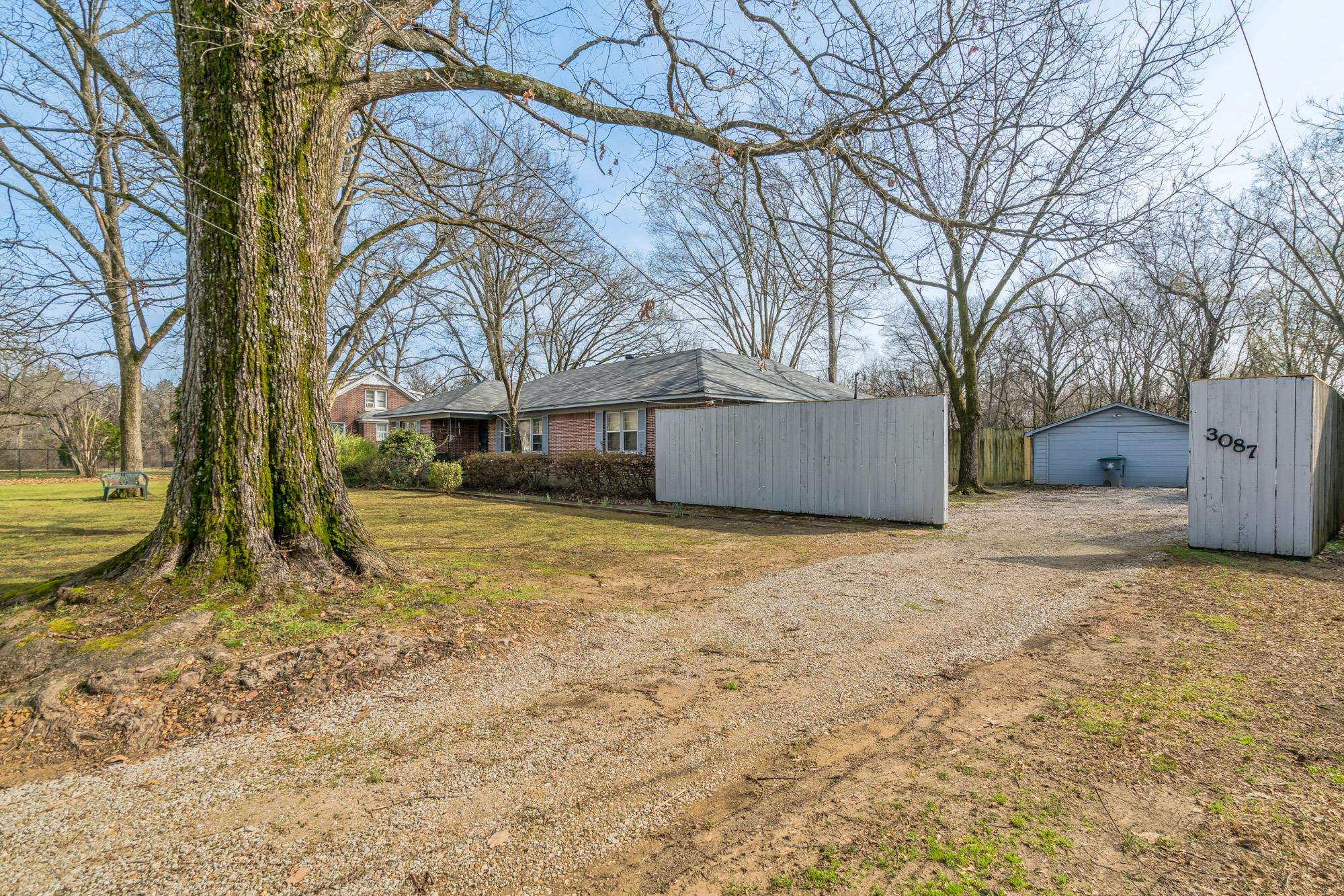 3087 James Road Memphis, TN 38128 - Photo 2 of 25 a view of a house with a yard covered in snow