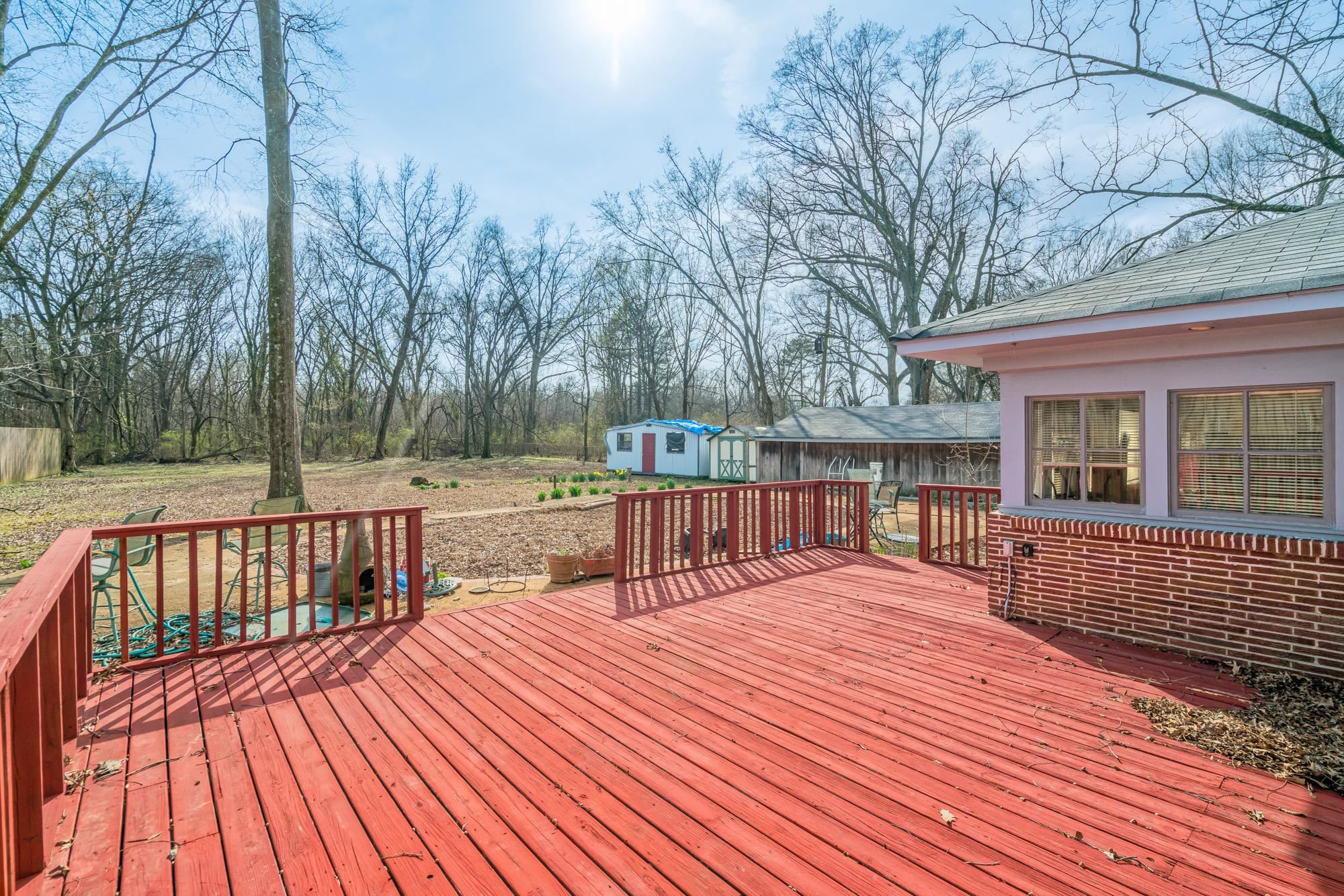 3087 James Road Memphis, TN 38128 - Photo 22 of 25 a view of backyard with deck and wooden floor