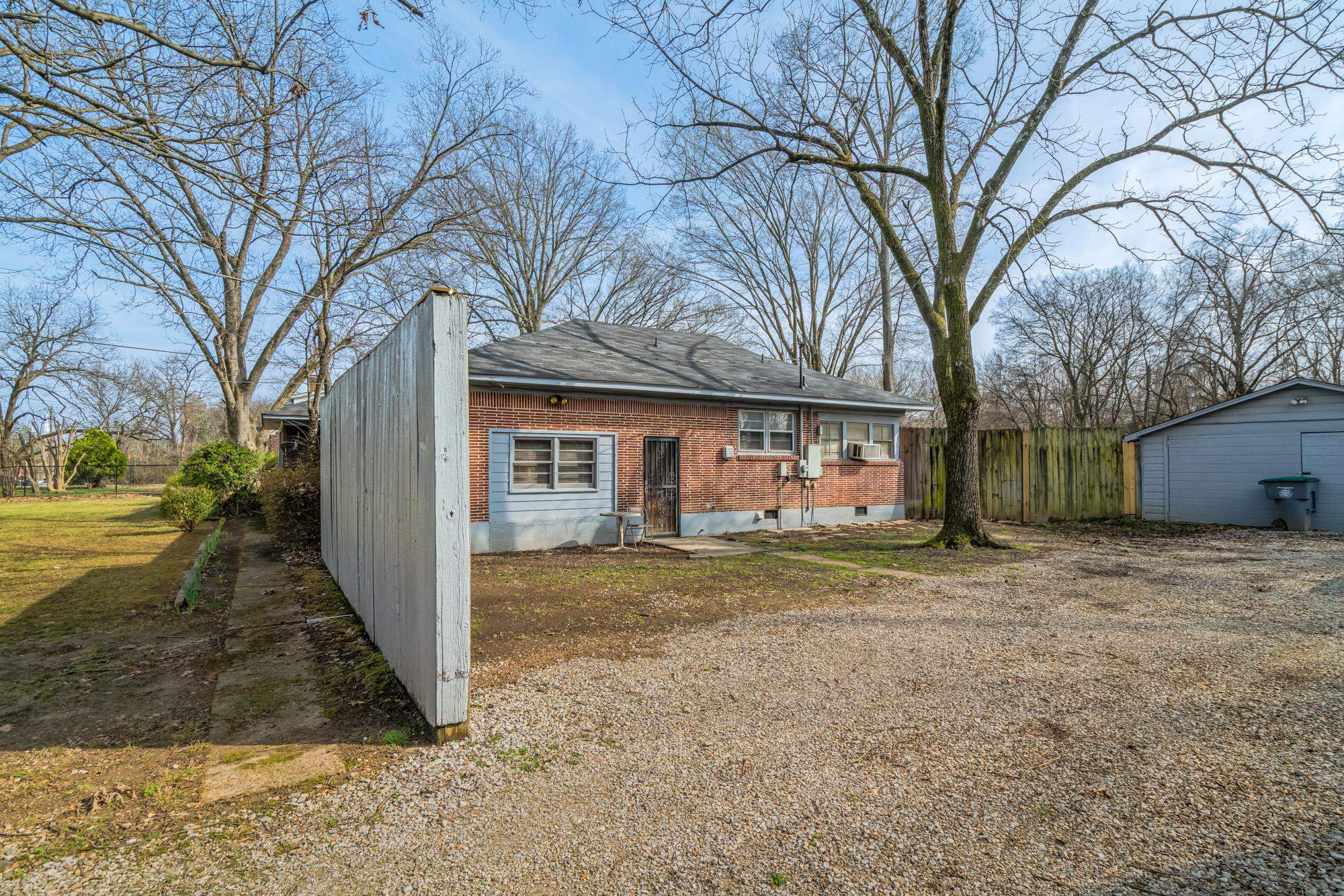 3087 James Road Memphis, TN 38128 - Photo 23 of 25 a view of a house with a yard covered in snow