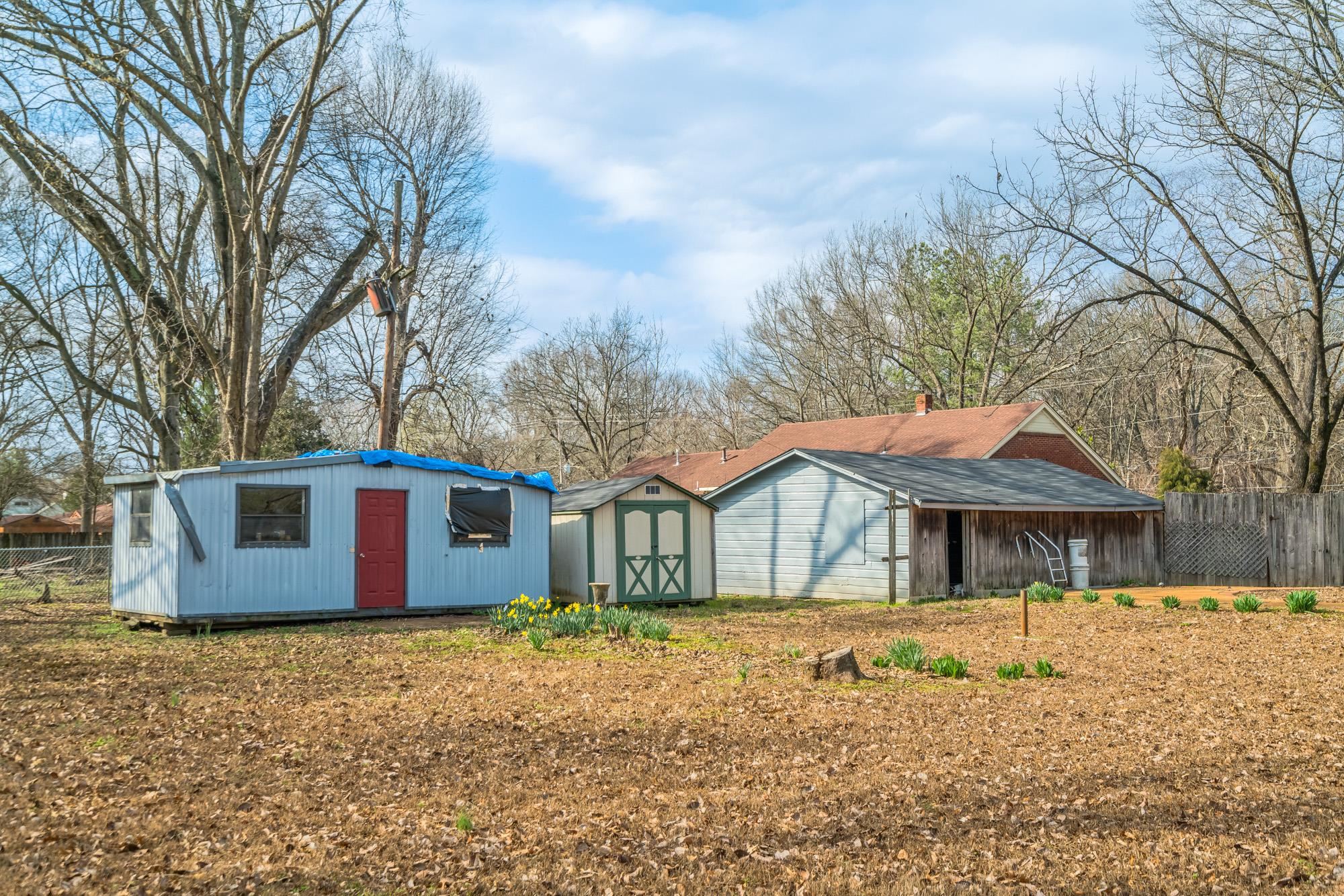 3087 James Road Memphis, TN 38128 - Photo 24 of 25 a front view of a house with a garden