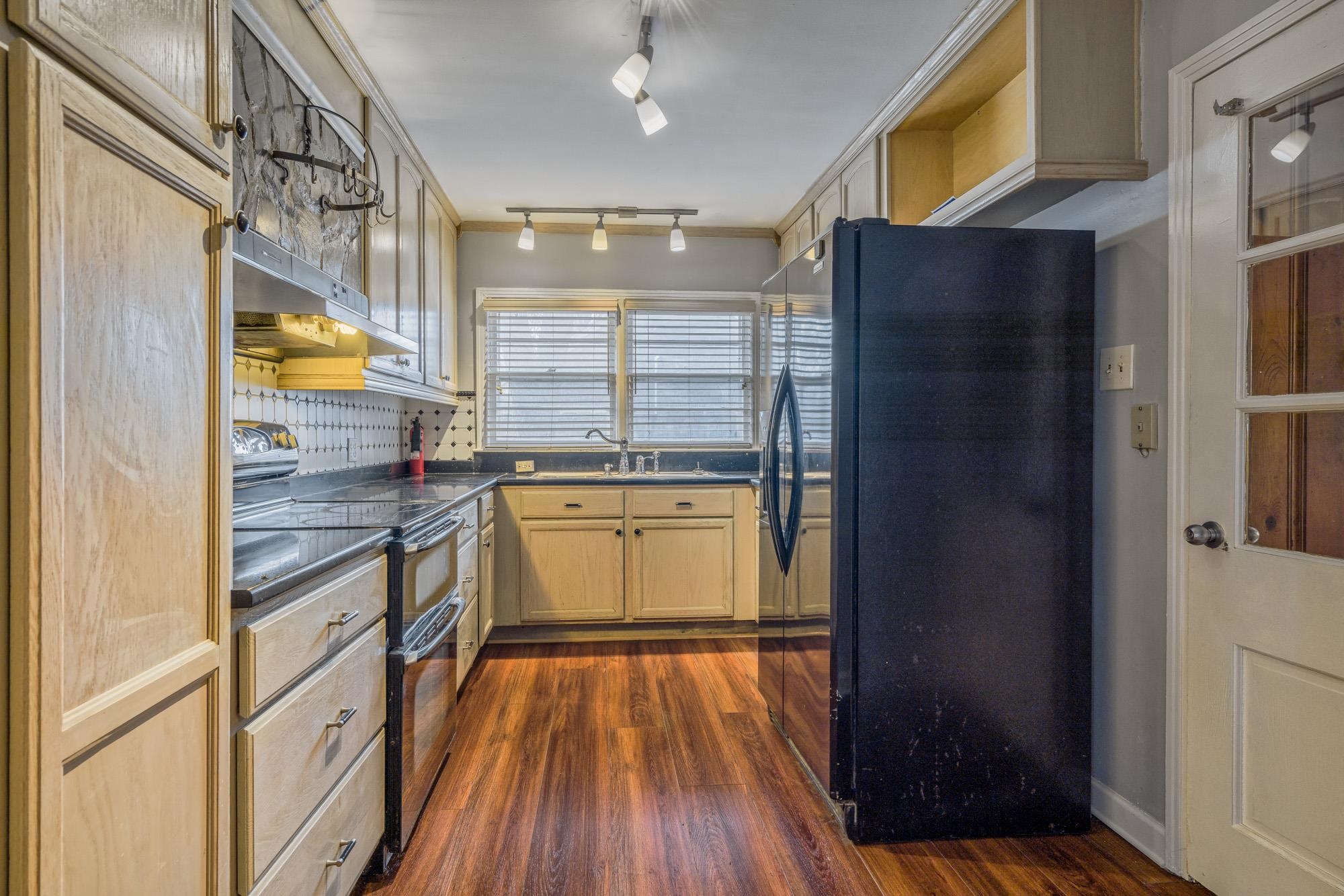 3087 James Road Memphis, TN 38128 - Photo 8 of 25 a kitchen with stainless steel appliances granite countertop a refrigerator and a stove top oven