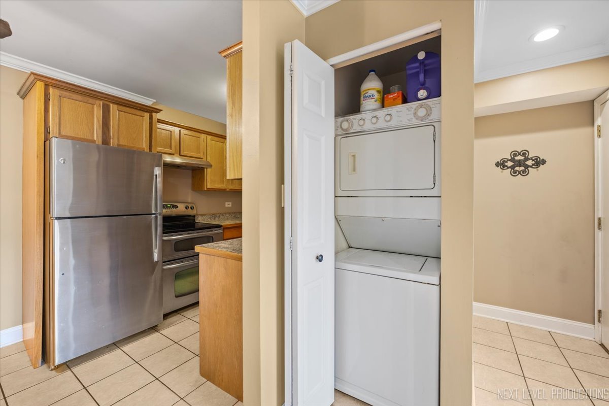 2100 Light Road, Unit 109 Oswego, IL 60543 - Photo 12 of 17 a kitchen with a refrigerator and a refrigerator