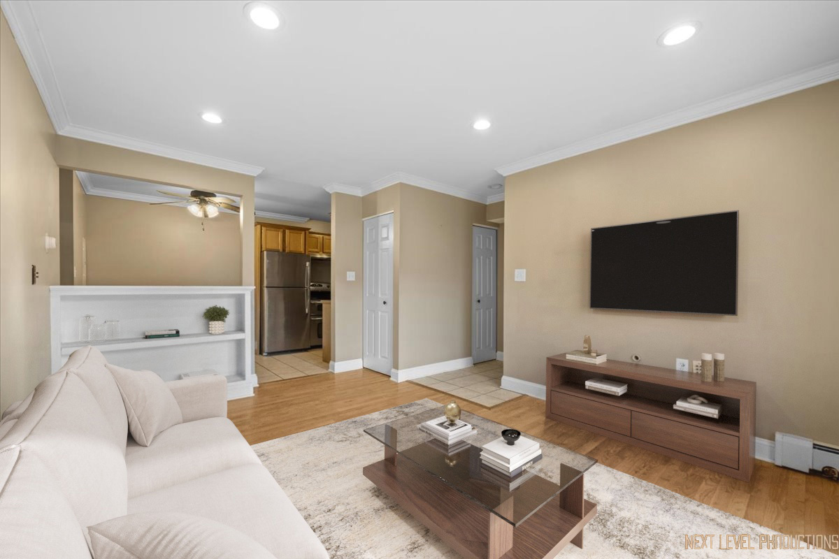 2100 Light Road, Unit 109 Oswego, IL 60543 - Photo 6 of 17 a living room with furniture and a flat screen tv