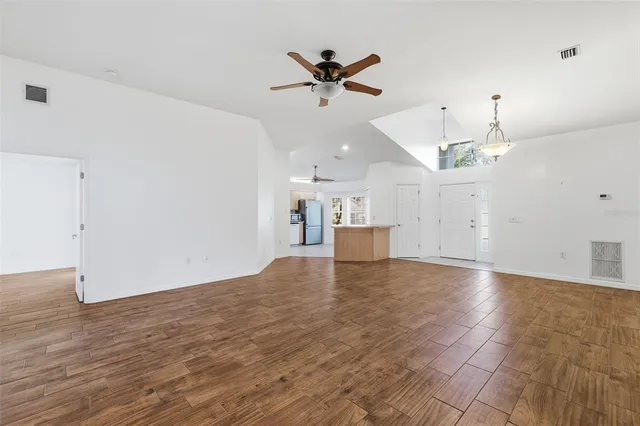 a view of a kitchen with a sink and a window