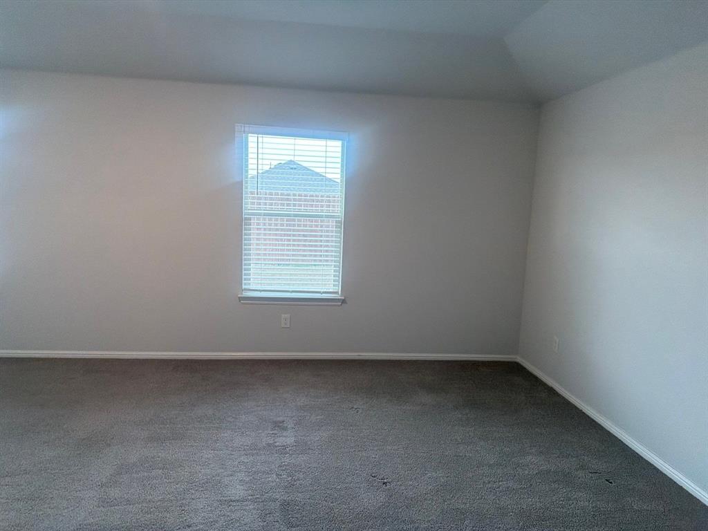 721 Durango Lane Cleburne, TX 76033 - Photo 14 of 25 an empty room with a window