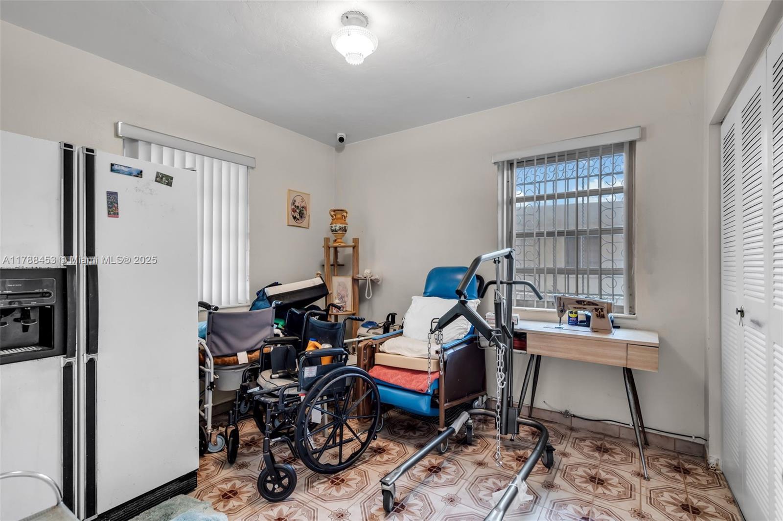 35 Southwest 60th Avenue Miami, FL 33144 - Photo 12 of 27 a room with furniture a rug and a window