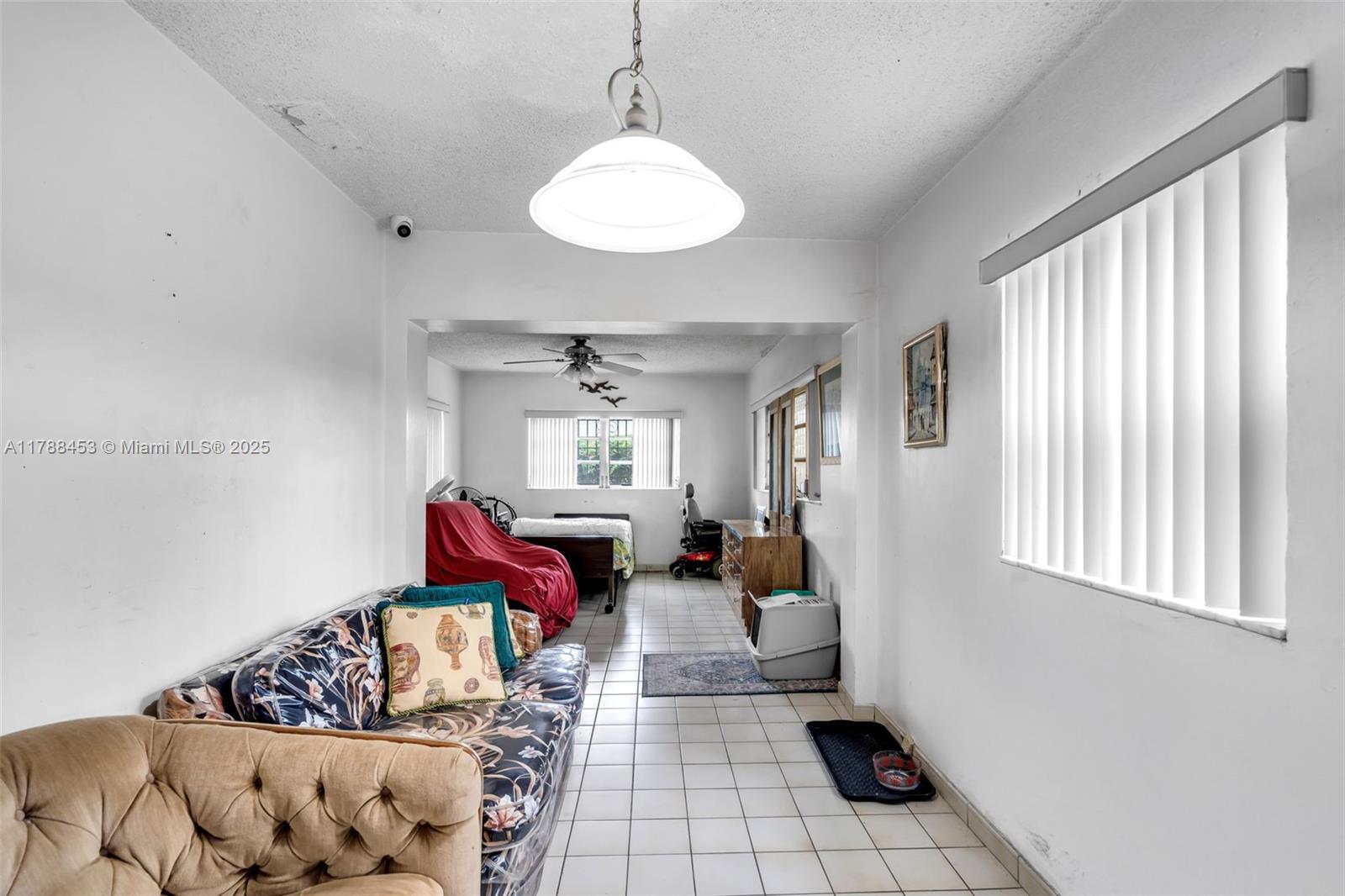 35 Southwest 60th Avenue Miami, FL 33144 - Photo 14 of 27 a living room with furniture and a window