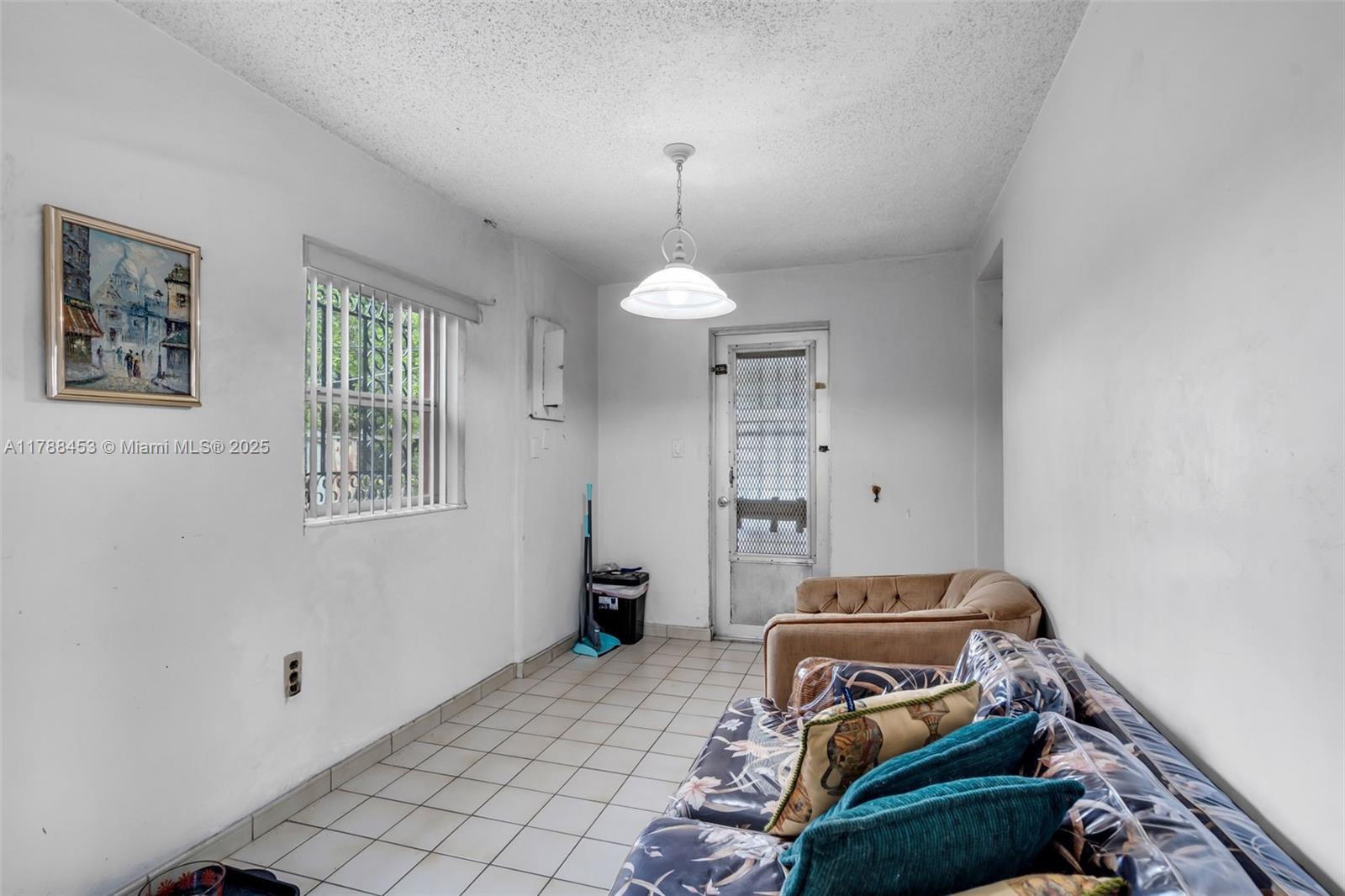 35 Southwest 60th Avenue Miami, FL 33144 - Photo 16 of 27 a bedroom with a bed and a window