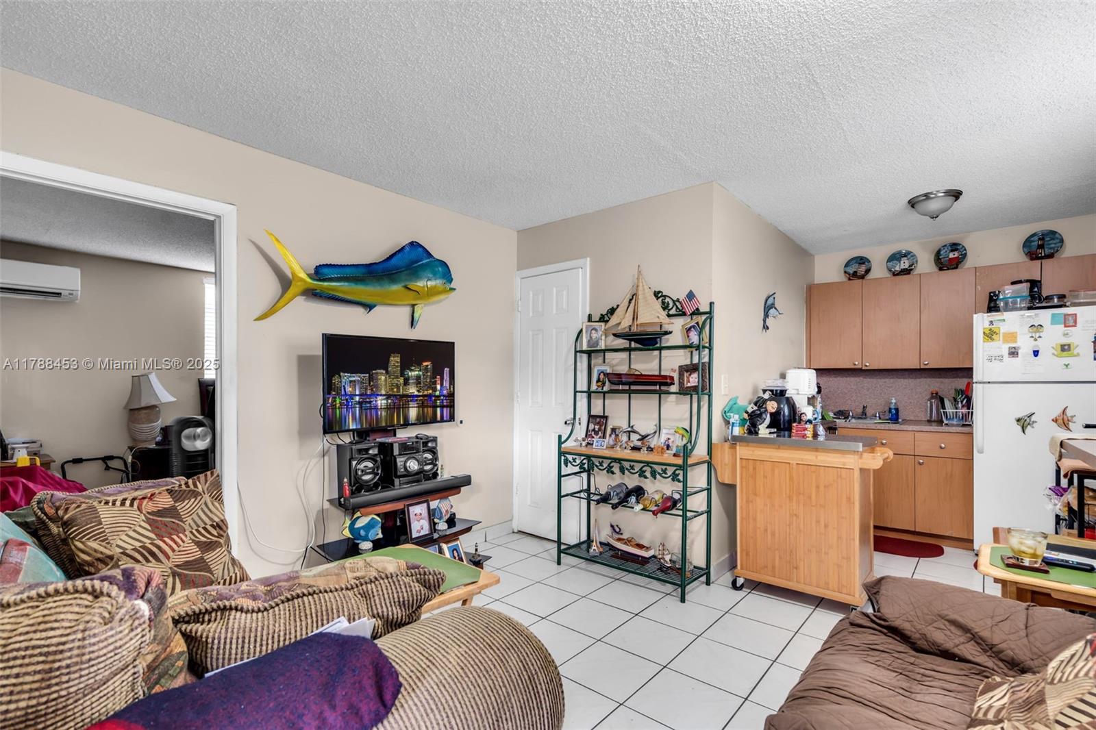 35 Southwest 60th Avenue Miami, FL 33144 - Photo 18 of 27 a bedroom with furniture and a book shelf