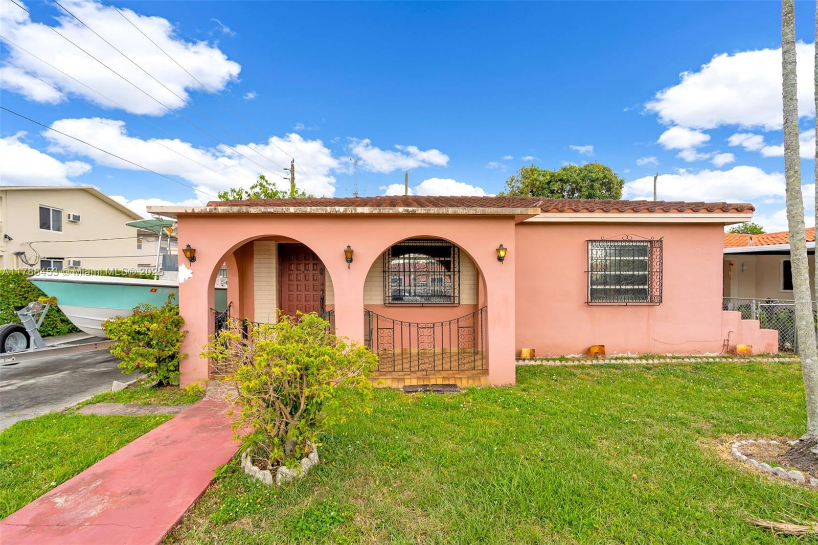 35 Southwest 60th Avenue Miami, FL 33144 - Photo 2 of 27 a front view of a house with garden