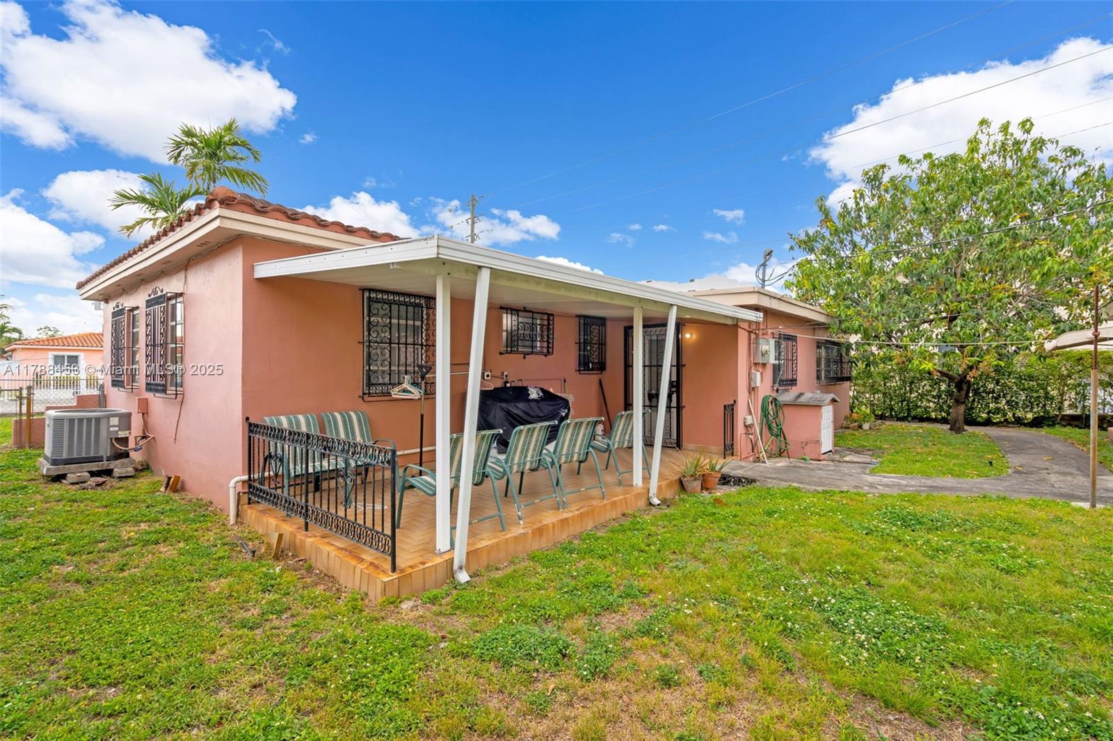 35 Southwest 60th Avenue Miami, FL 33144 - Photo 23 of 27 a view of a house with a yard and sitting area