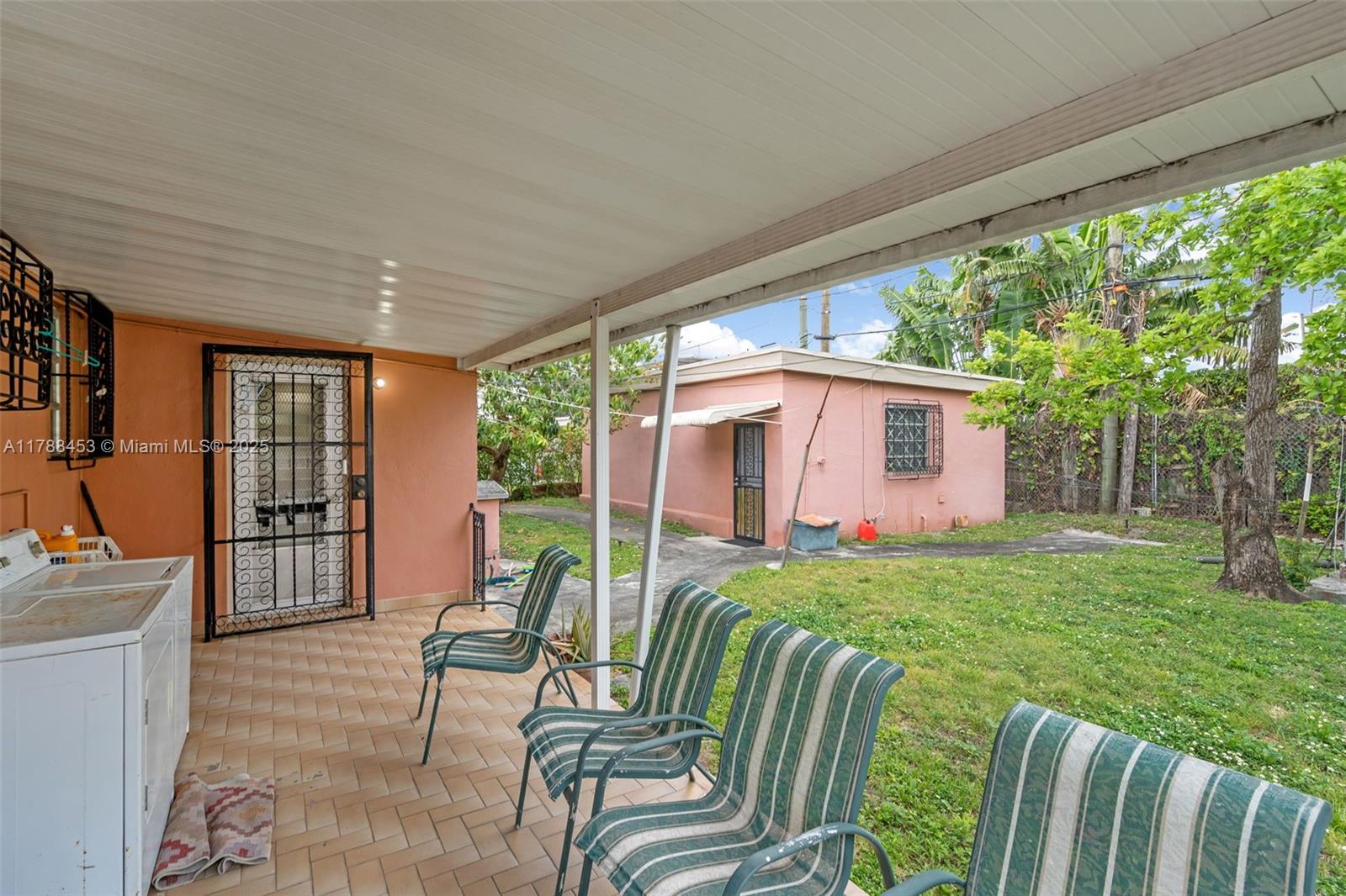35 Southwest 60th Avenue Miami, FL 33144 - Photo 25 of 27 a balcony with furniture and a garden