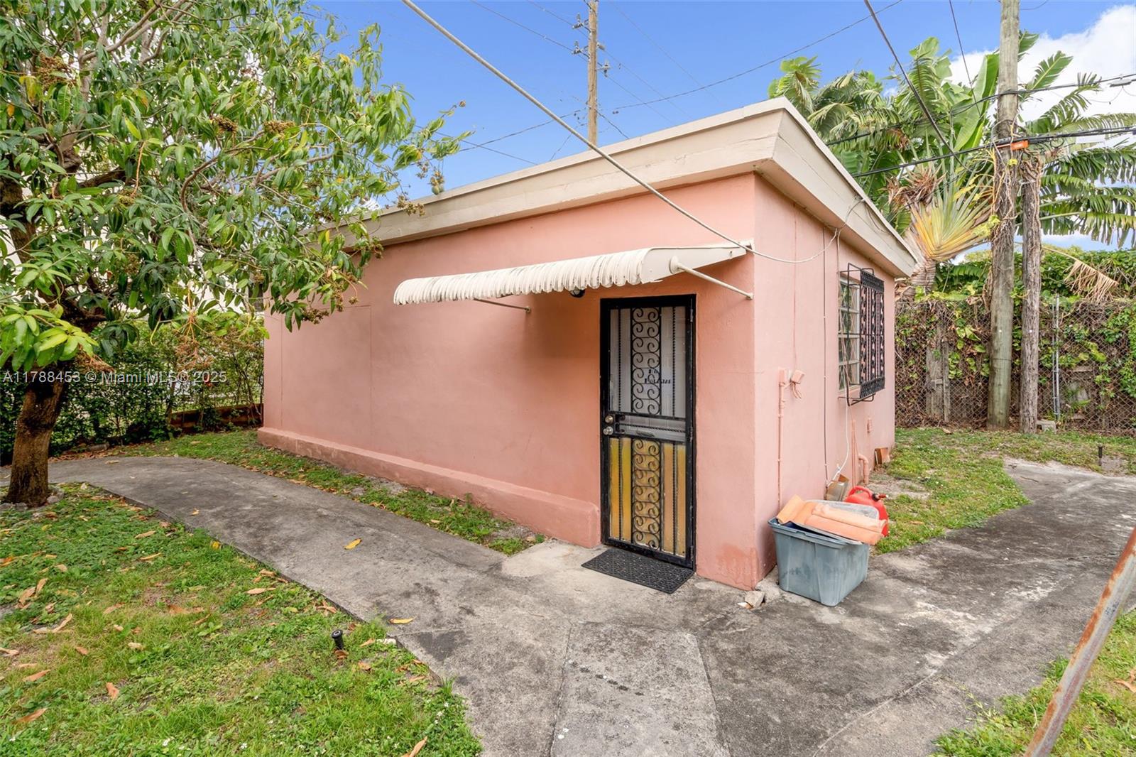 35 Southwest 60th Avenue Miami, FL 33144 - Photo 27 of 27 a front view of a house with a yard