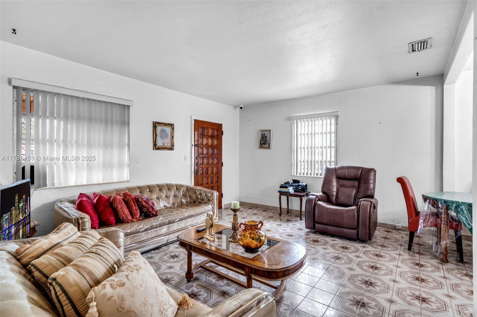 35 Southwest 60th Avenue Miami, FL 33144 - Photo 5 of 27 a living room with furniture or couch and a window