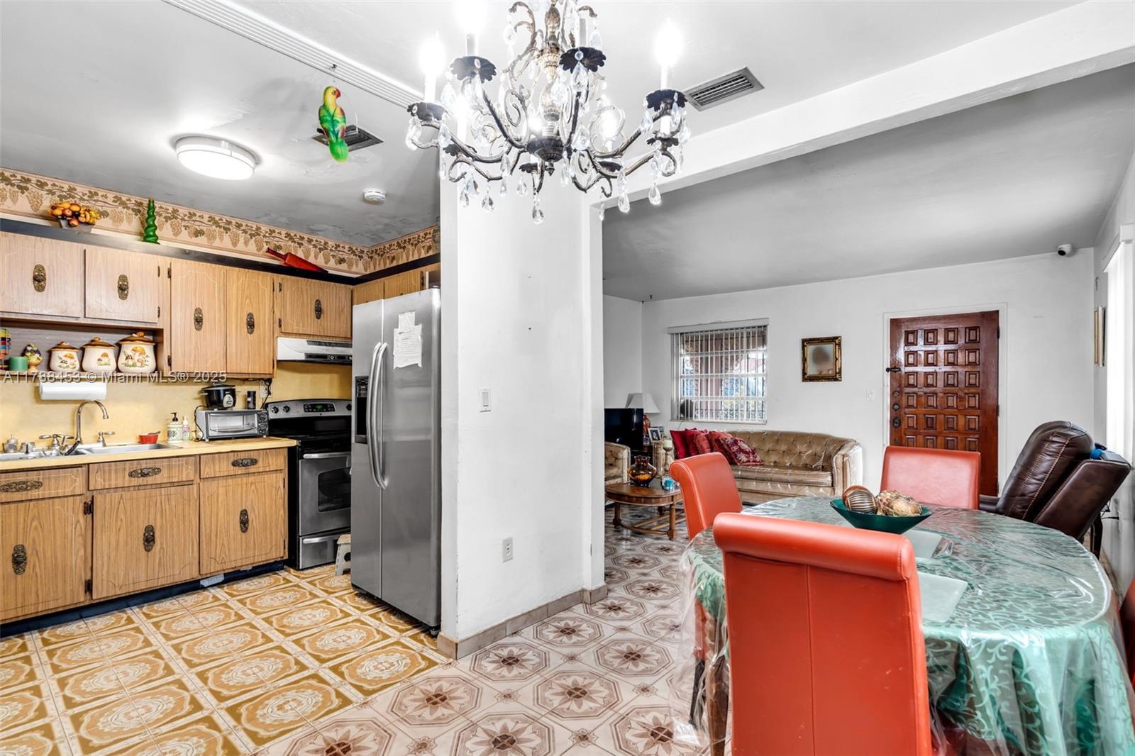35 Southwest 60th Avenue Miami, FL 33144 - Photo 7 of 27 a kitchen with stainless steel appliances granite countertop a refrigerator and a stove top oven