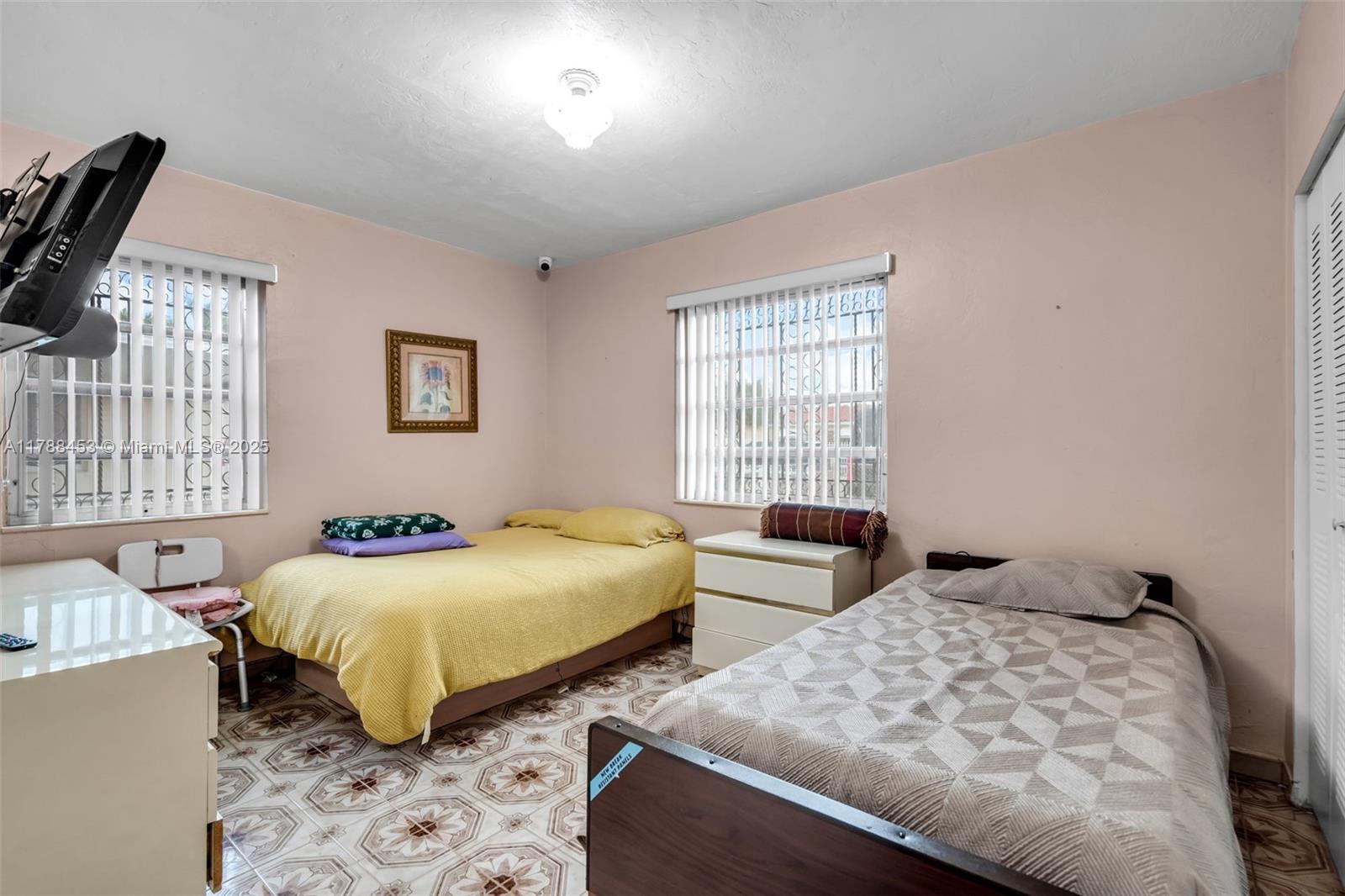 35 Southwest 60th Avenue Miami, FL 33144 - Photo 10 of 27 a bedroom with two beds and a window