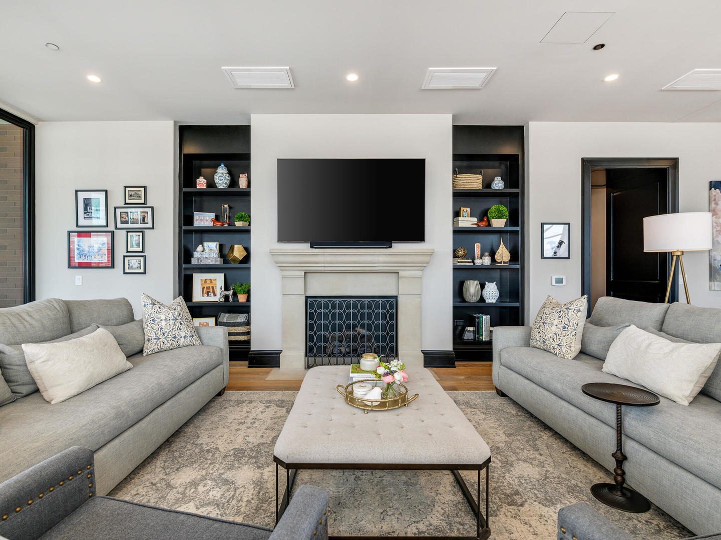 1109 West Washington Boulevard, Unit 7A Chicago, IL 60607 - Photo 16 of 41 a living room with furniture a fireplace and a flat screen tv