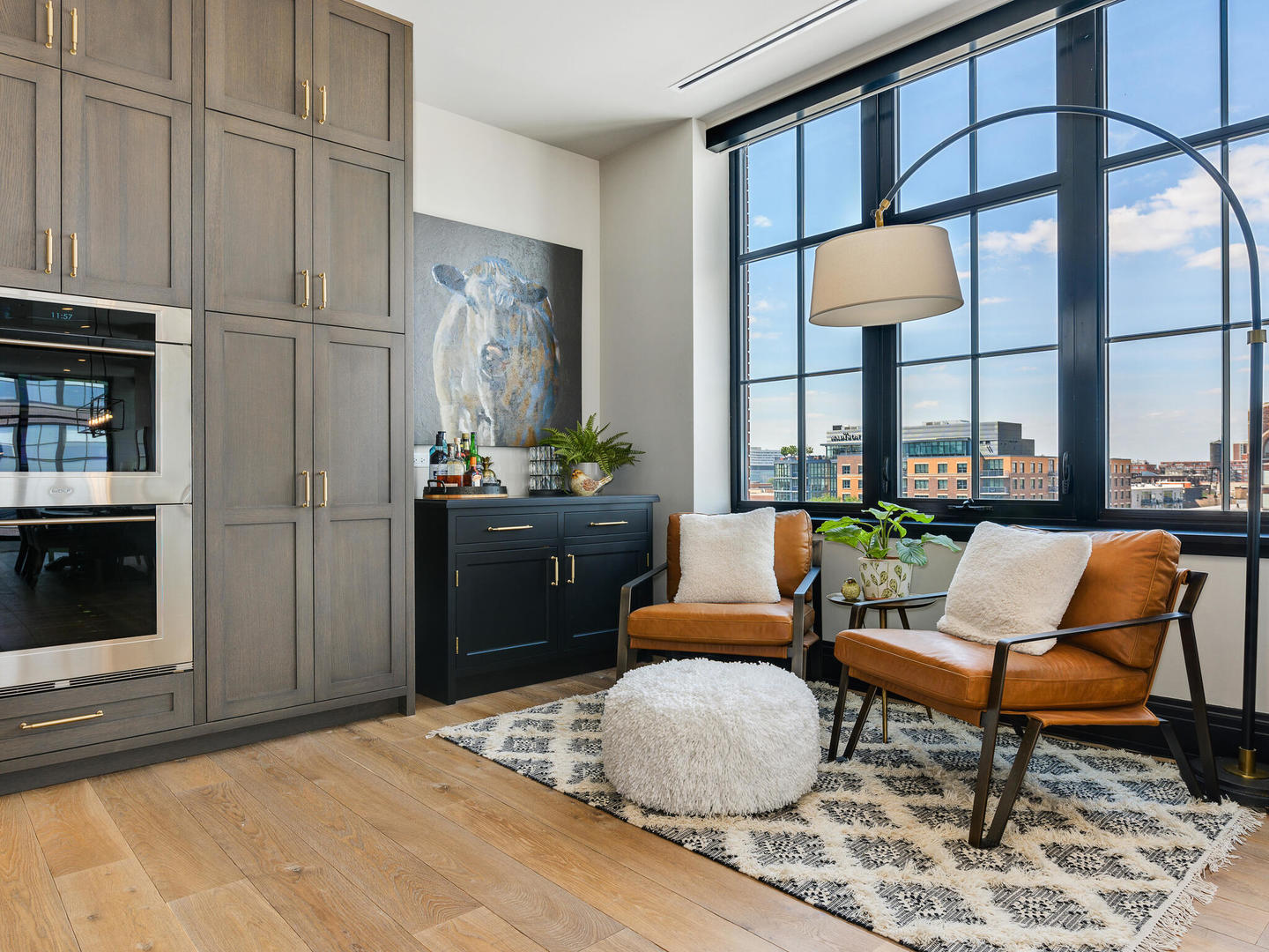 1109 West Washington Boulevard, Unit 7A Chicago, IL 60607 - Photo 22 of 41 a living room with furniture a lamp and a table