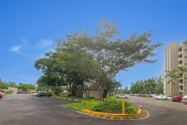 a view of a cars parked in front of a building