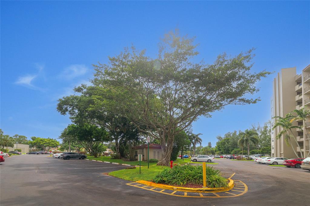 3940 Inverrary Boulevard, Unit 108A Lauderhill, FL 33319 - Photo 24 of 39 a backyard of a house with lots of green space