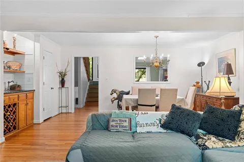 a spacious bedroom with a large bed and a flat screen tv