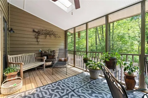 a view of a balcony with chair and potted plant