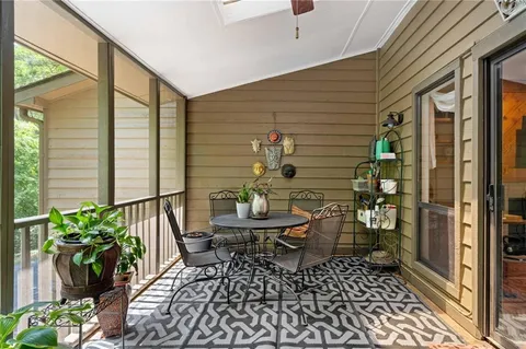 a spacious bedroom with a bed and a window