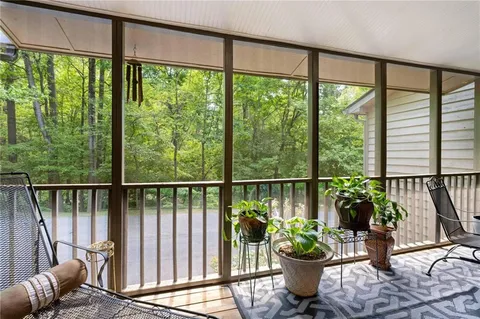 a bedroom with bed and a chandelier