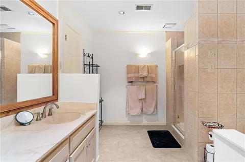 a bathroom with a double vanity sink and a mirror