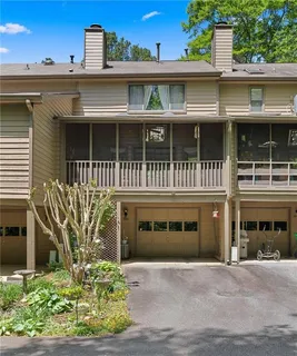 a front view of a residential apartment building with a yard