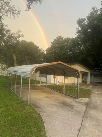 a bathroom with a granite countertop sink and washing machine