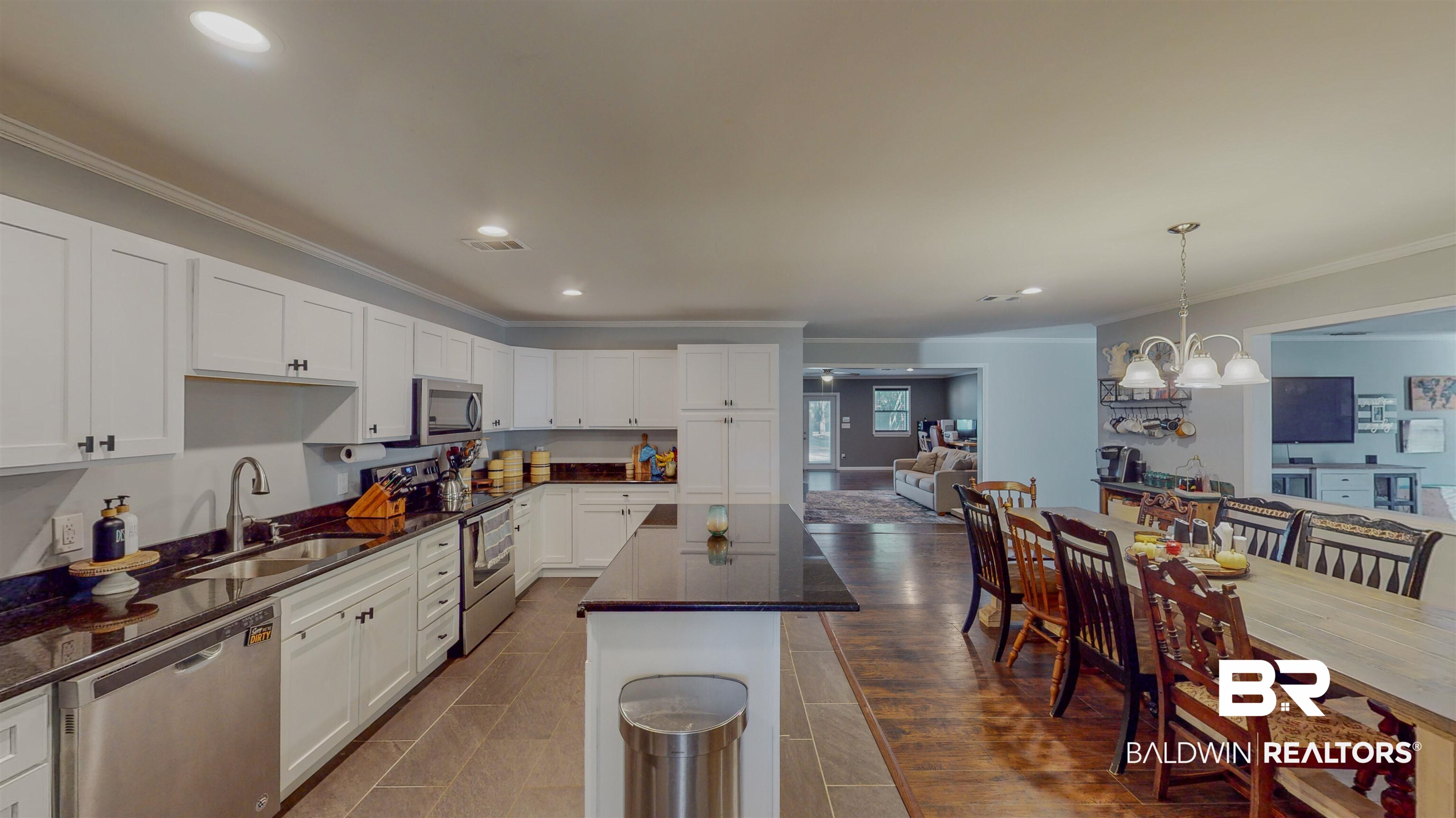 19365 Keller Road Foley, AL 36535 - Photo 6 of 41 Kitchen with pendant lighting, a center island, sink, white cabinetry, and stainless steel appliances