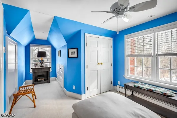 a bedroom with furniture and window