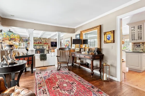 a living room with furniture and a rug