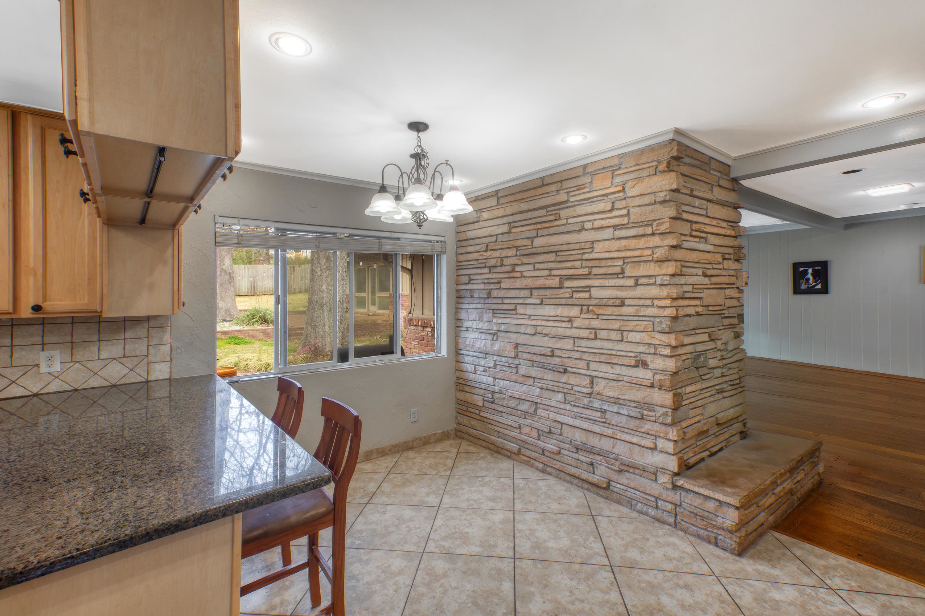 5680 North Angela Road Memphis, TN 38120 - Photo 18 of 33 Dining area with ornamental molding, light tile patterned flooring, a chandelier, and recessed lighting