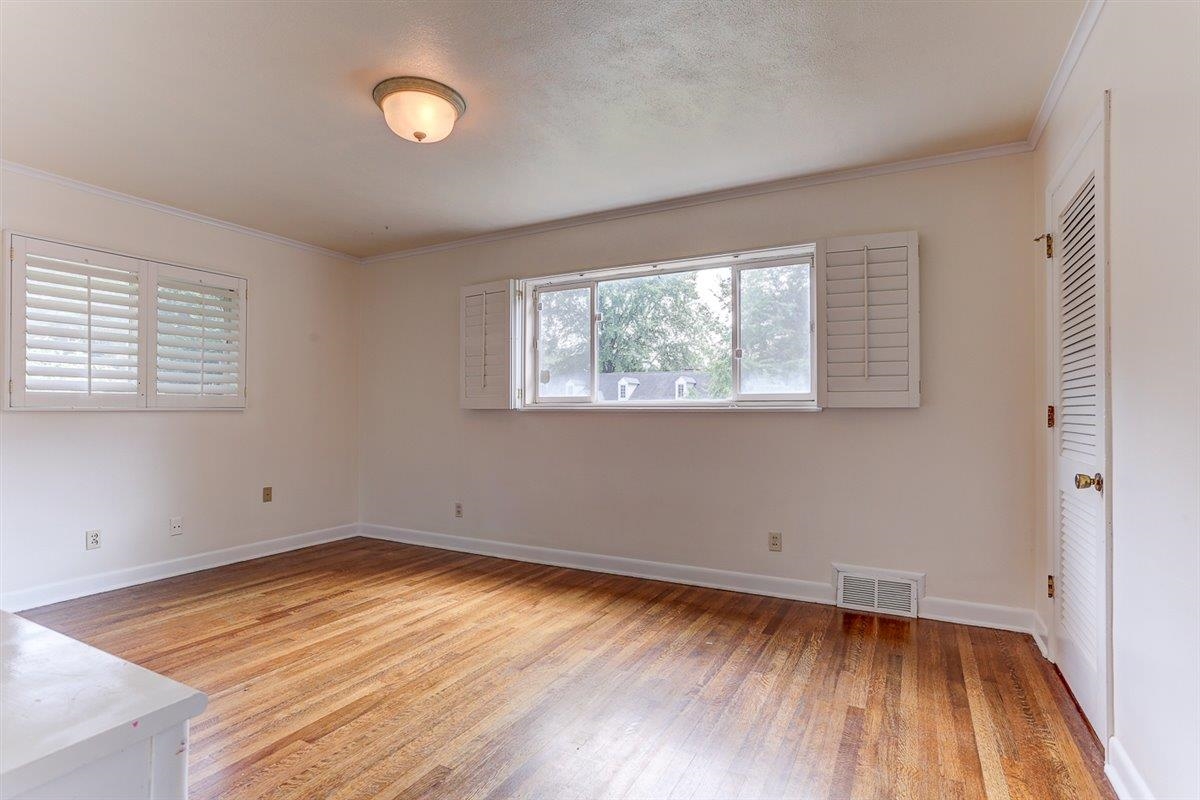 5680 North Angela Road Memphis, TN 38120 - Photo 10 of 33 Unfurnished bedroom featuring ornamental molding and light wood finished floors