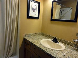 180 Evergreen Road, Unit 202E Dillon, CO 80435 - Photo 13 of 24 a bathroom with a granite countertop sink and a mirror