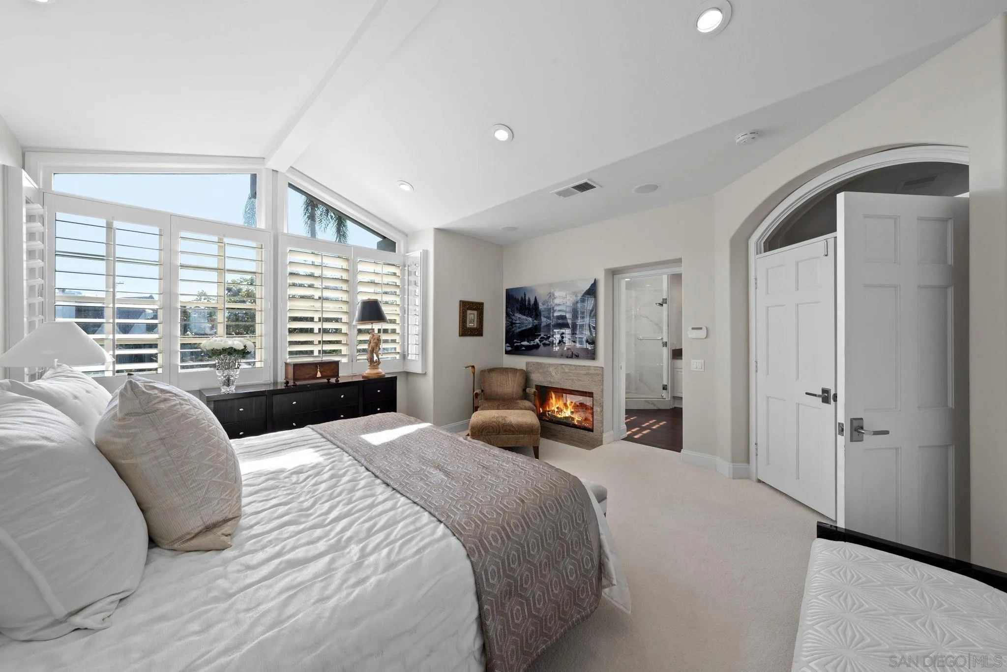 7723 Ivanhoe Avenue La Jolla, CA 92037 - Photo 14 of 35 a bedroom with a bed a large window and walk in closet