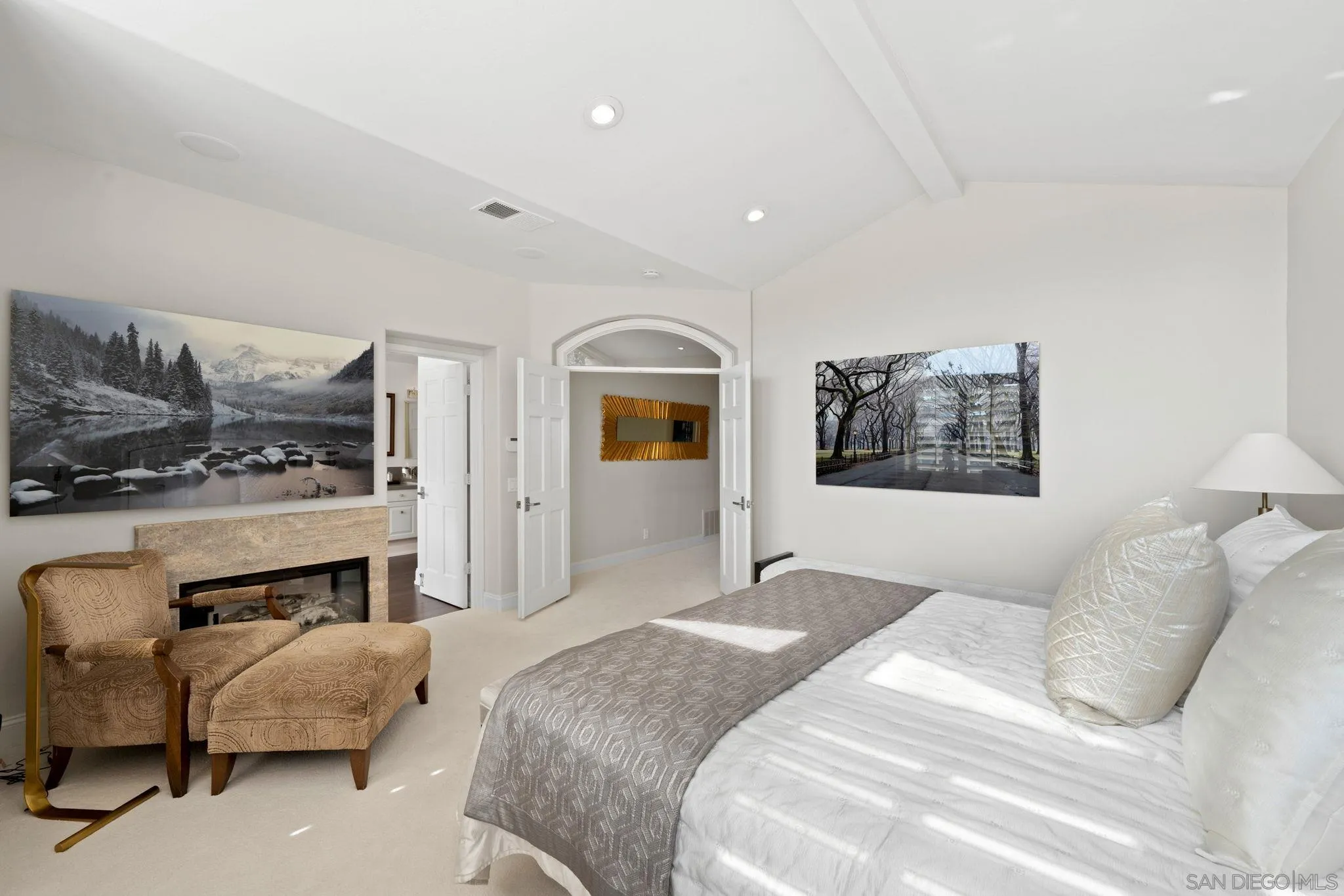 7723 Ivanhoe Avenue La Jolla, CA 92037 - Photo 16 of 35 a bedroom with a bed and a fireplace