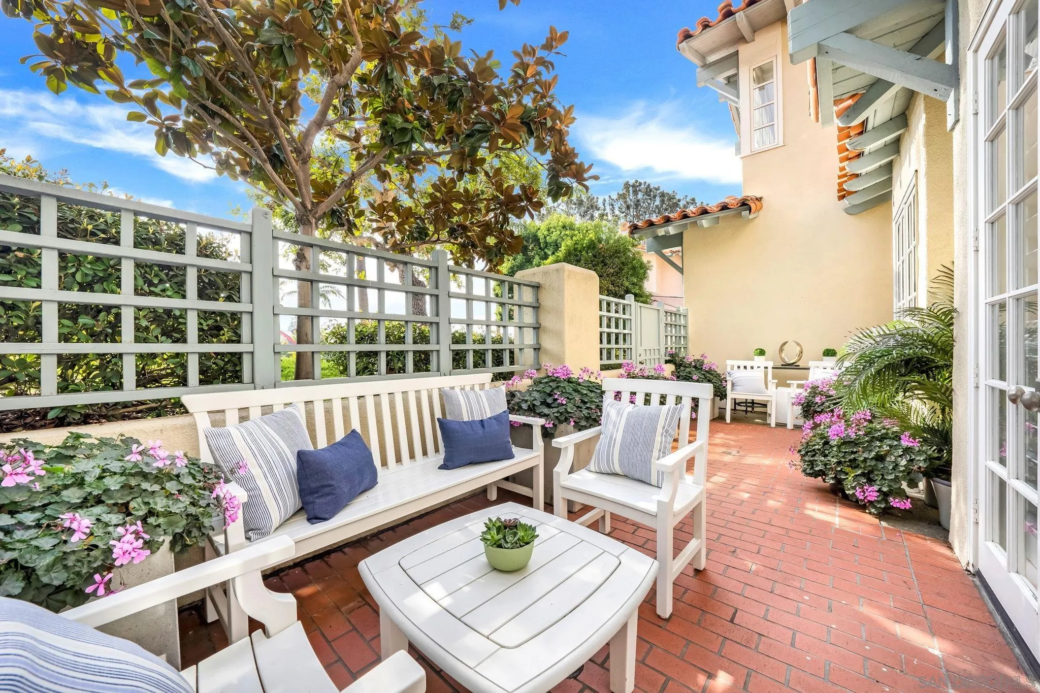 7723 Ivanhoe Avenue La Jolla, CA 92037 - Photo 25 of 35 a view of a patio with couches table and chairs and potted plants