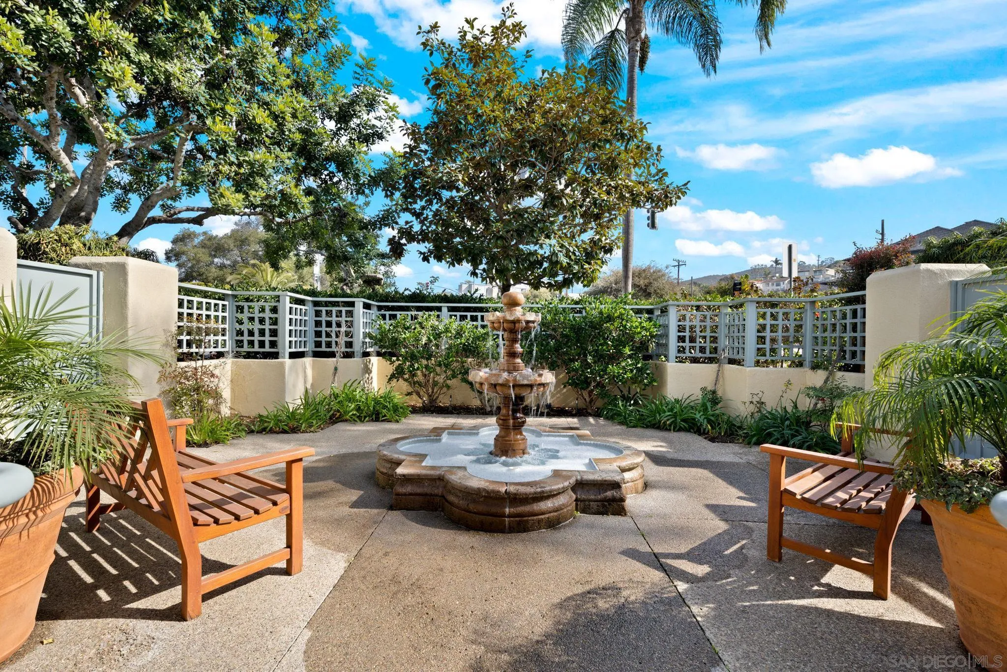 7723 Ivanhoe Avenue La Jolla, CA 92037 - Photo 31 of 35 a view of a patio with couches table and chairs and potted plants